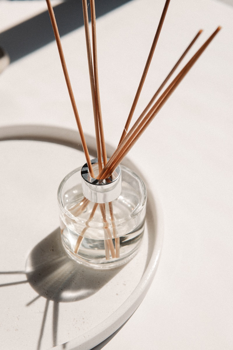 brown wooden sticks in clear glass container